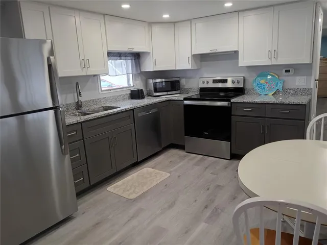 a view of a room with chair and wooden floor