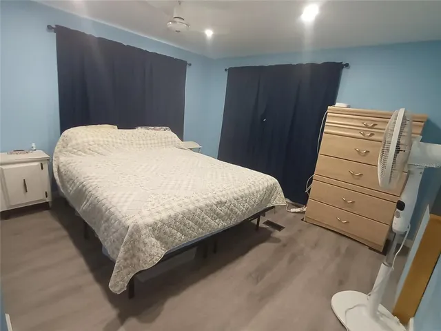 a kitchen with a stove top oven and refrigerator