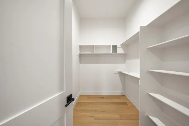 a view of a hall with a floor to ceiling window and a projector