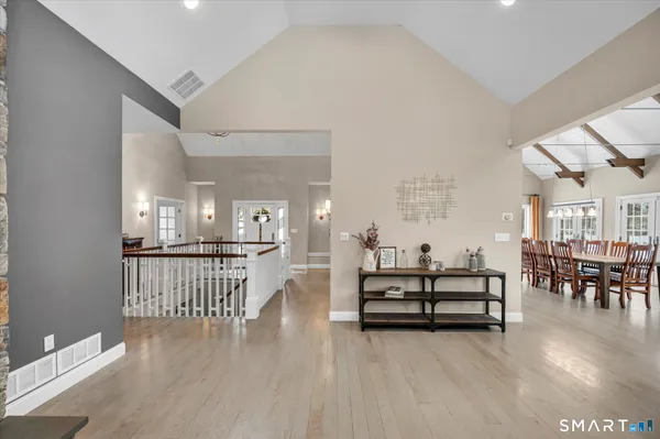 a view of dining room with furniture and wooden floor