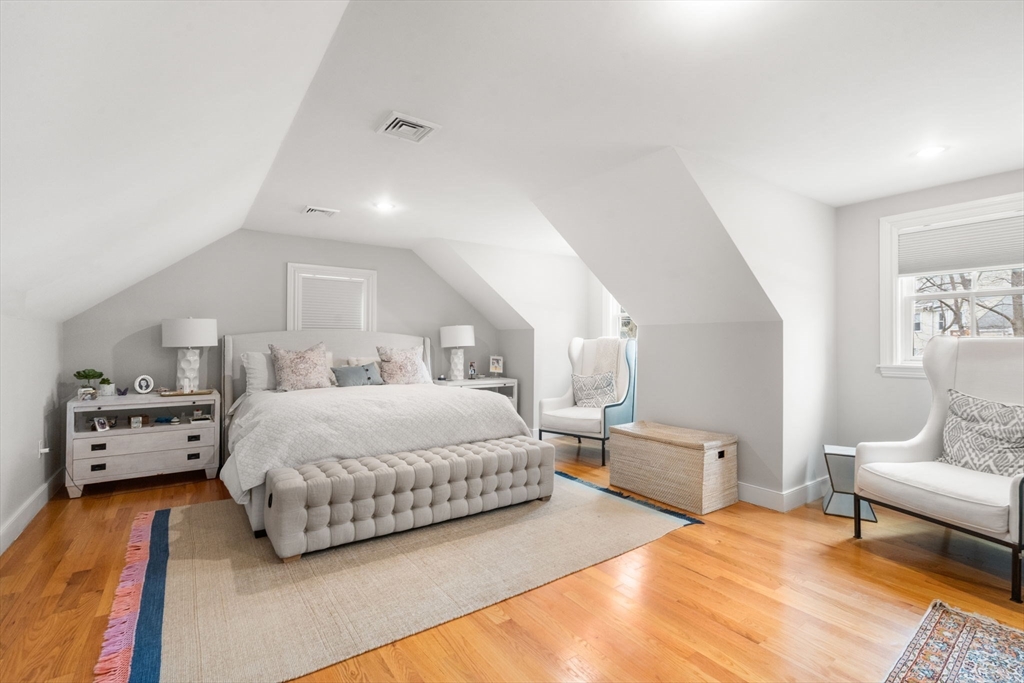 75 Auburn Street Newton, MA 02466 - Photo 13 of 34 a spacious bedroom with a bed and furniture
