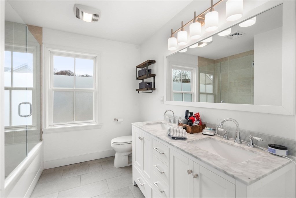75 Auburn Street Newton, MA 02466 - Photo 16 of 34 a bathroom with a sink double vanity and a tub