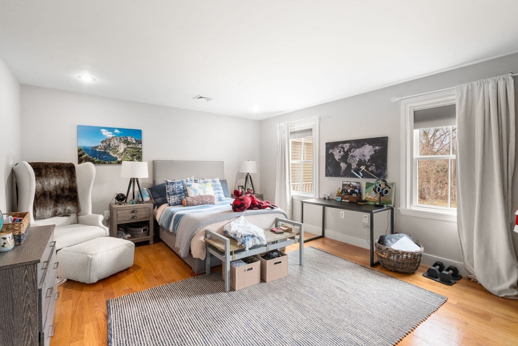 75 Auburn Street Newton, MA 02466 - Photo 17 of 34 a bedroom with furniture and a wooden floor