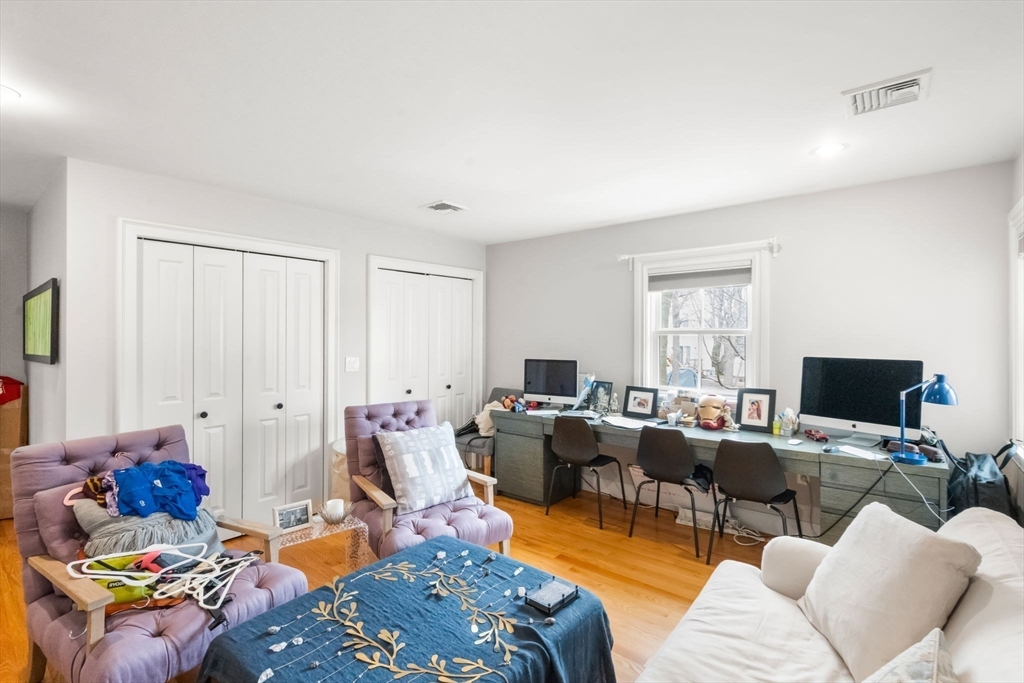 75 Auburn Street Newton, MA 02466 - Photo 20 of 34 a living room with furniture a flat screen tv and a window