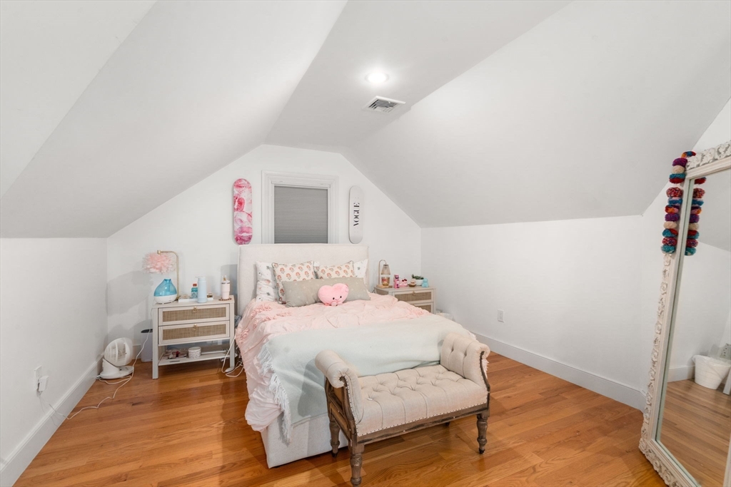75 Auburn Street Newton, MA 02466 - Photo 23 of 34 a bedroom with a bed and a chair