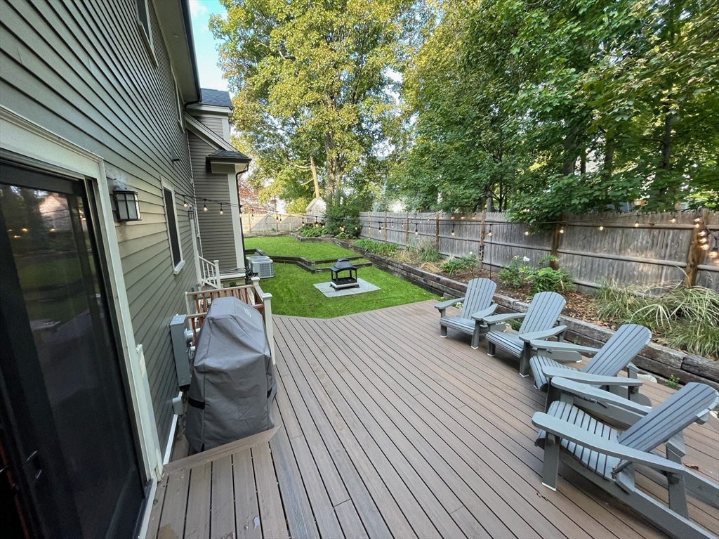 75 Auburn Street Newton, MA 02466 - Photo 33 of 34 a view of backyard with a table and chairs