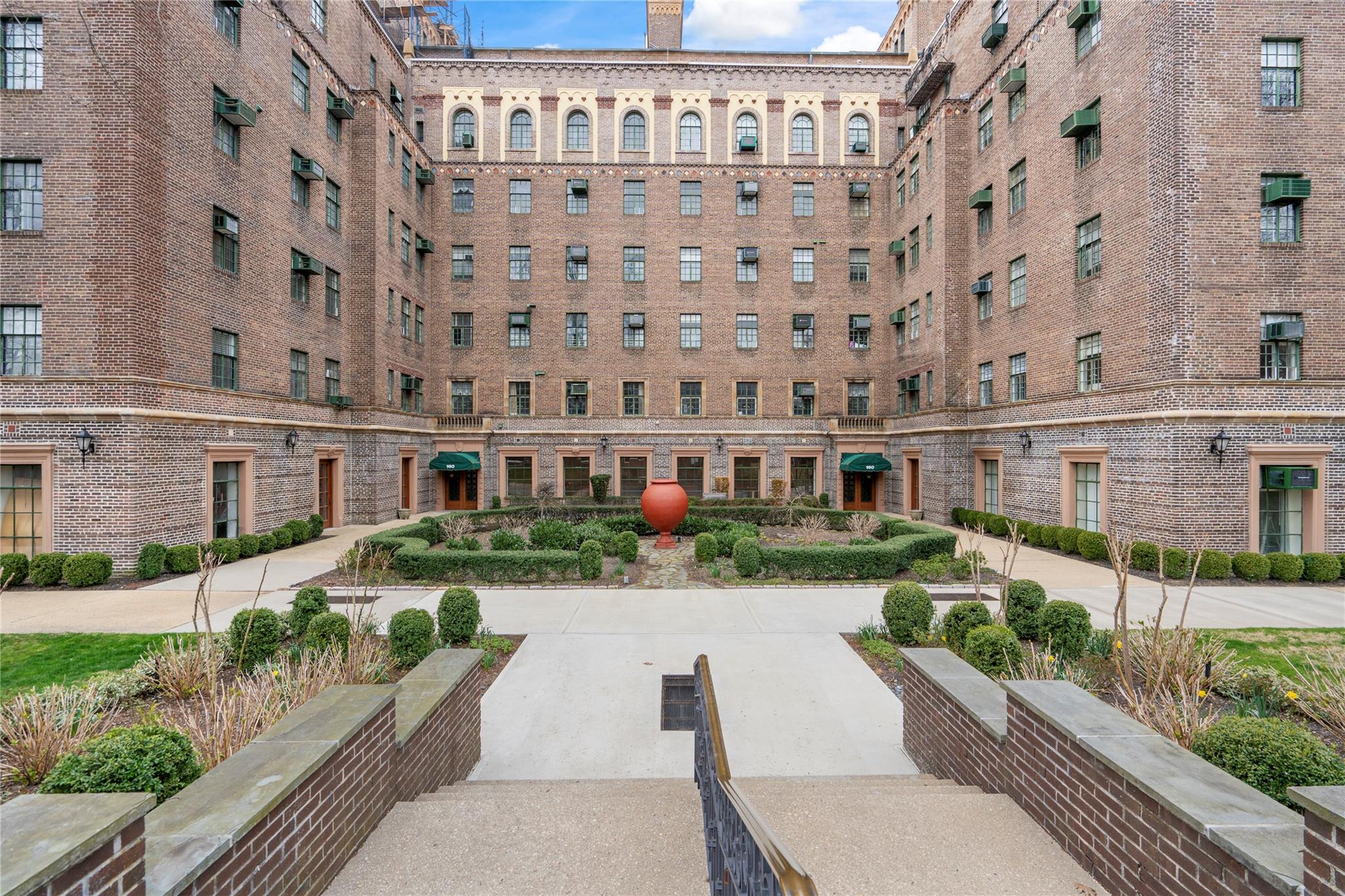 a view of a building with a garden