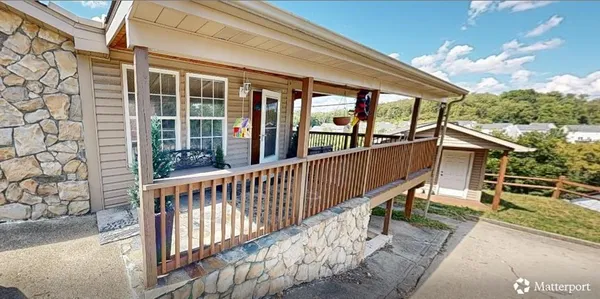 a view of a chair and table in the balcony