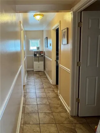 a kitchen with granite countertop a refrigerator and a stove top oven