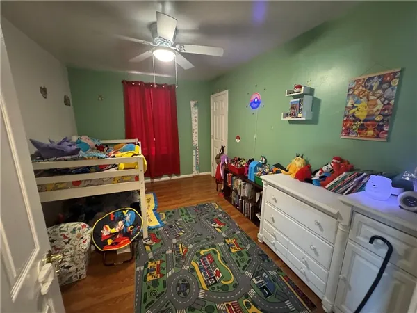 a bed room with a bed and a tv