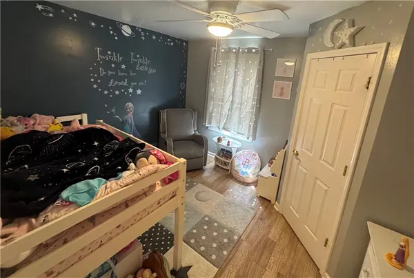 a living room with furniture and a dining table