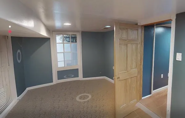 a room with furniture a flat screen tv and a fireplace