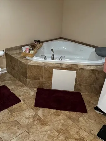 a bathroom with a double vanity sink and mirror