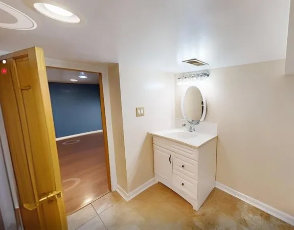 a bathroom with a sink and toilet