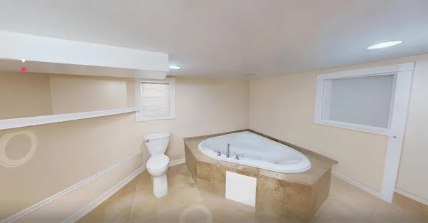 a picture of a wall and a white building