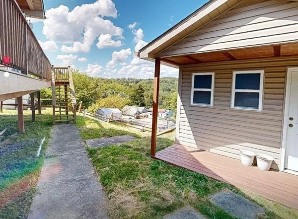 a view of a backyard with sitting area