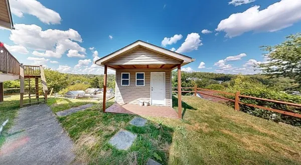 a view of a backyard with sitting area