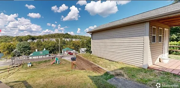 a view of a backyard with plants and a patio