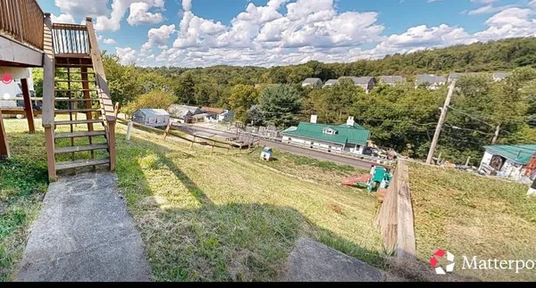a view of swimming pool with a patio