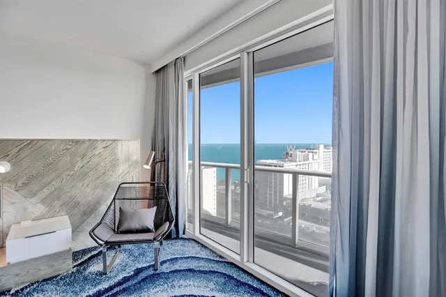 a bedroom with furniture and a window