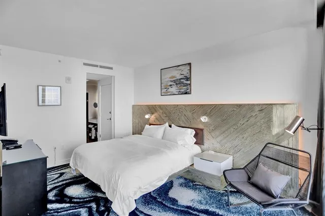 a bathroom with a shower and a sink