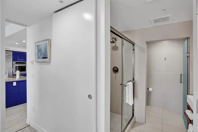a bathroom with a tub and shower