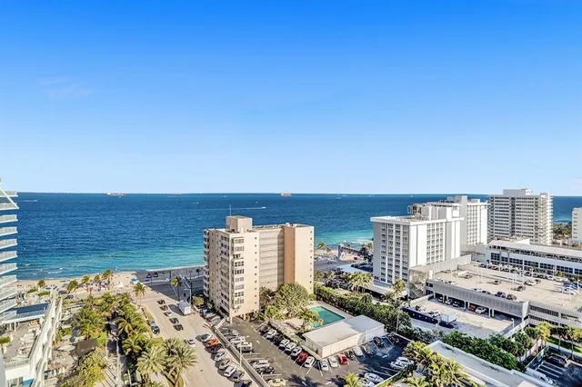 a view of city with ocean