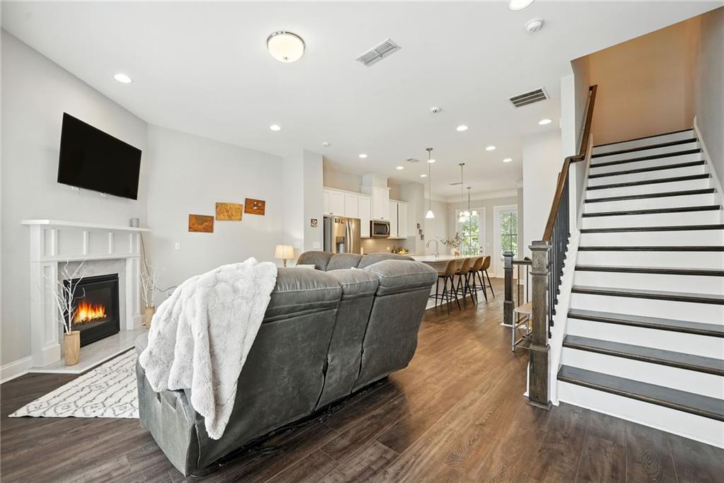 705 Bismark Road Northeast Atlanta, GA 30324 - Photo 12 of 41 a living room with furniture and a fireplace