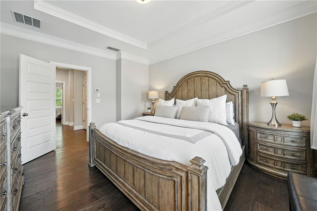 705 Bismark Road Northeast Atlanta, GA 30324 - Photo 14 of 41 a bedroom with bed and a dresser