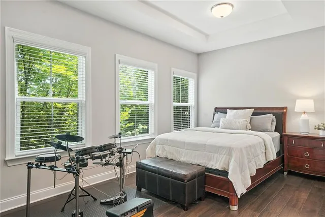 a bedroom with a bed and a table chair