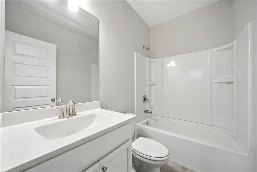 705 Bismark Road Northeast Atlanta, GA 30324 - Photo 25 of 41 a bathroom with a sink a toilet and a bathtub