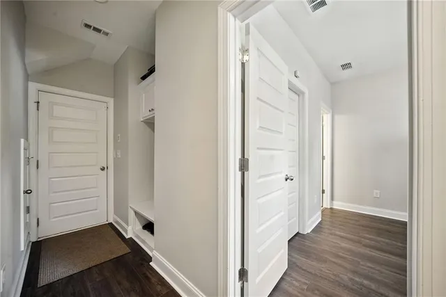 wooden floor with white walls