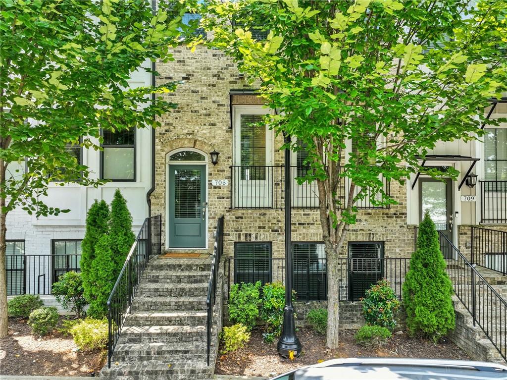 705 Bismark Road Northeast Atlanta, GA 30324 - Photo 29 of 41 a front view of a house with a garden