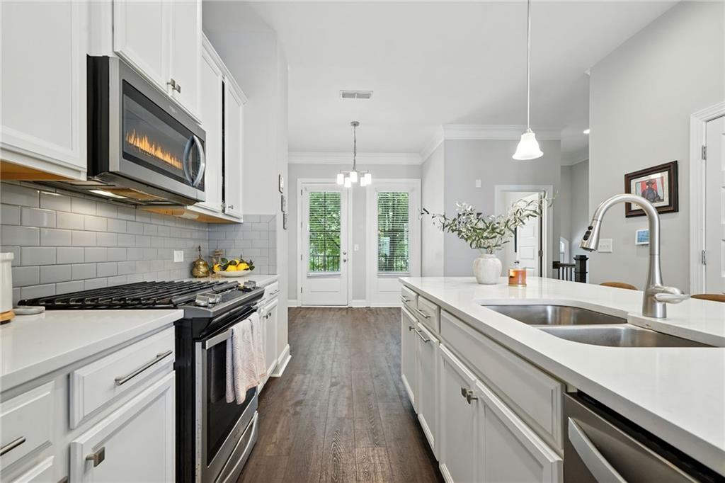 705 Bismark Road Northeast Atlanta, GA 30324 - Photo 7 of 41 a kitchen with a sink stove and microwave
