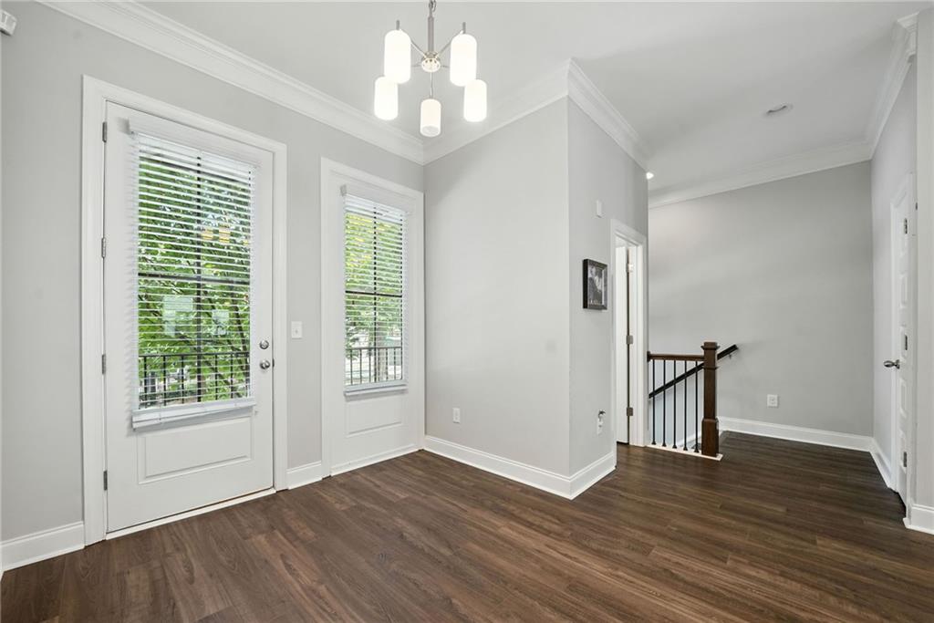 705 Bismark Road Northeast Atlanta, GA 30324 - Photo 8 of 41 a view of empty room with wooden floor and fan