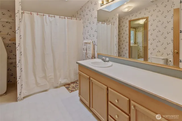 a bathroom with a sink and a mirror