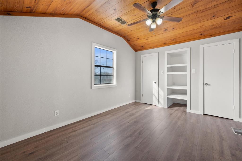 443 County Road 3799 Springtown, TX 76082 - Photo 23 of 33 Unfurnished bedroom featuring wooden ceiling, wood finished floors, lofted ceiling, and ceiling fan