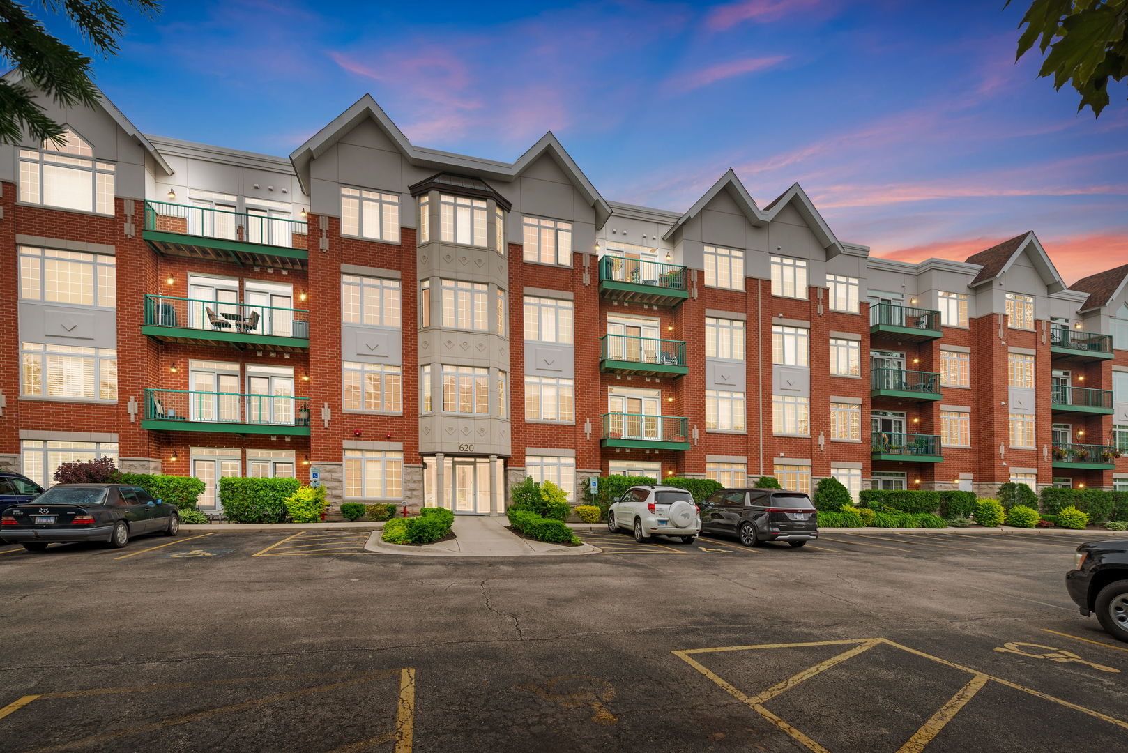 620 McHenry Road, Unit 102 Wheeling, IL 60090 - Photo 1 of 18 a front view of a building with street view
