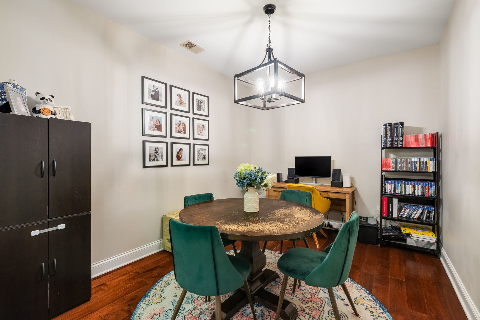 620 McHenry Road, Unit 102 Wheeling, IL 60090 - Photo 12 of 18 a view of a dining room with furniture wooden floor and a chandelier