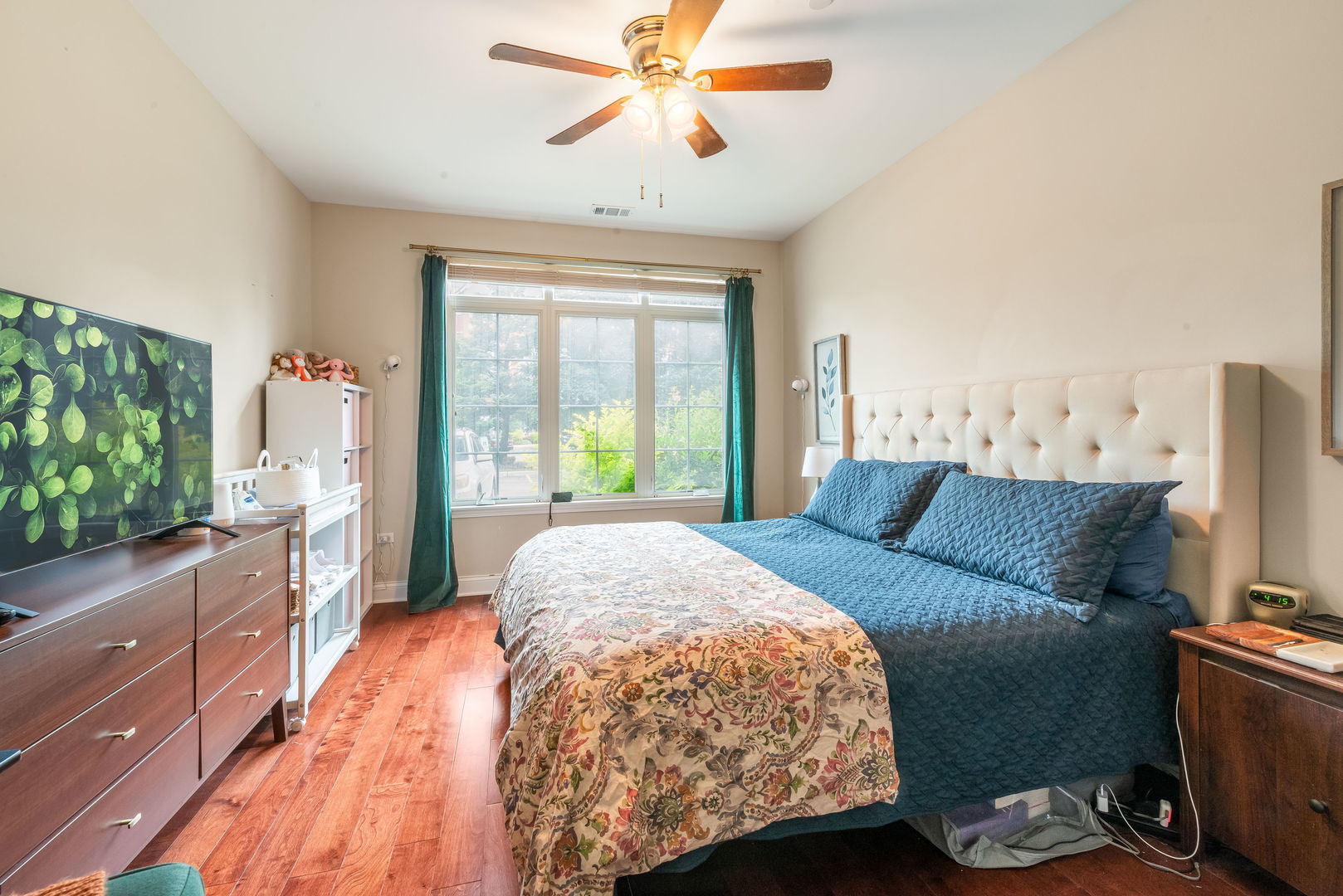 620 McHenry Road, Unit 102 Wheeling, IL 60090 - Photo 13 of 18 a bed sitting in a bedroom next to a window