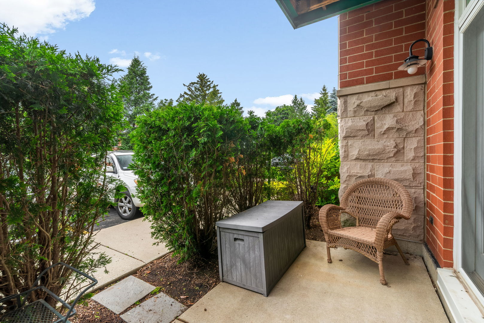 620 McHenry Road, Unit 102 Wheeling, IL 60090 - Photo 18 of 18 a backyard of a house with outdoor seating