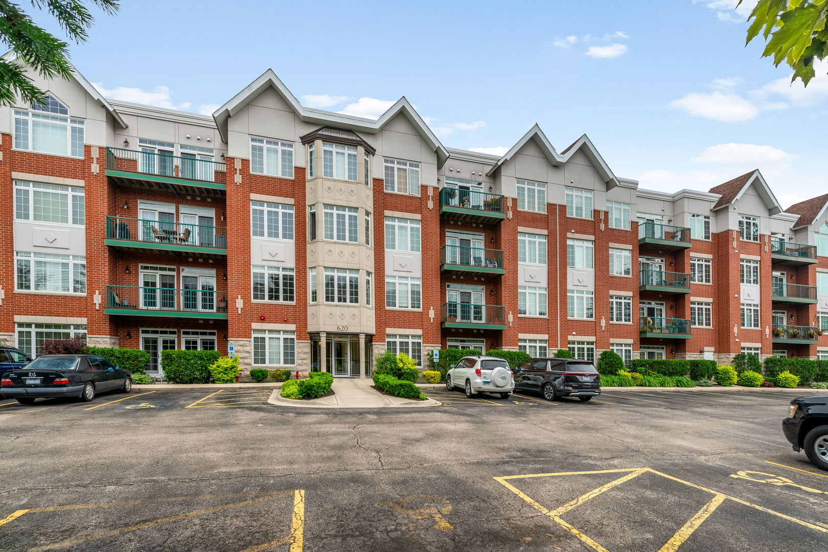 620 McHenry Road, Unit 102 Wheeling, IL 60090 - Photo 3 of 18 a front view of a building with street view