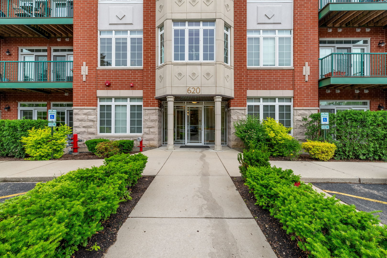 620 McHenry Road, Unit 102 Wheeling, IL 60090 - Photo 4 of 18 front view of a brick building