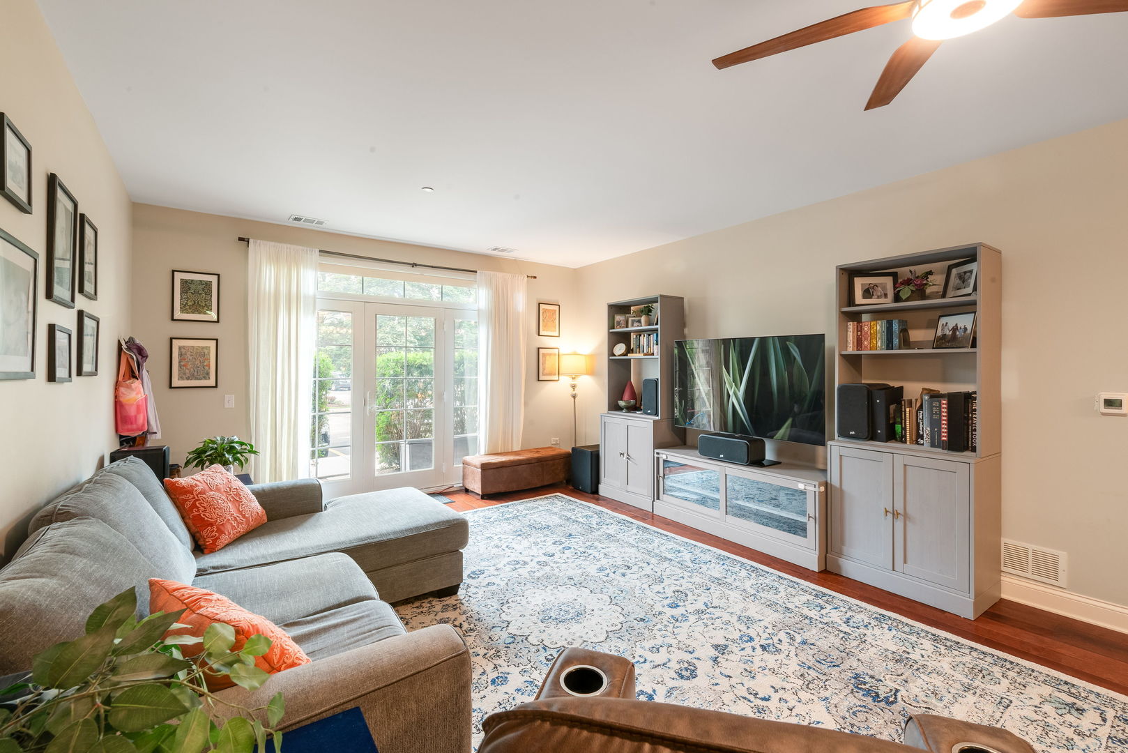 620 McHenry Road, Unit 102 Wheeling, IL 60090 - Photo 5 of 18 a living room with furniture and a flat screen tv
