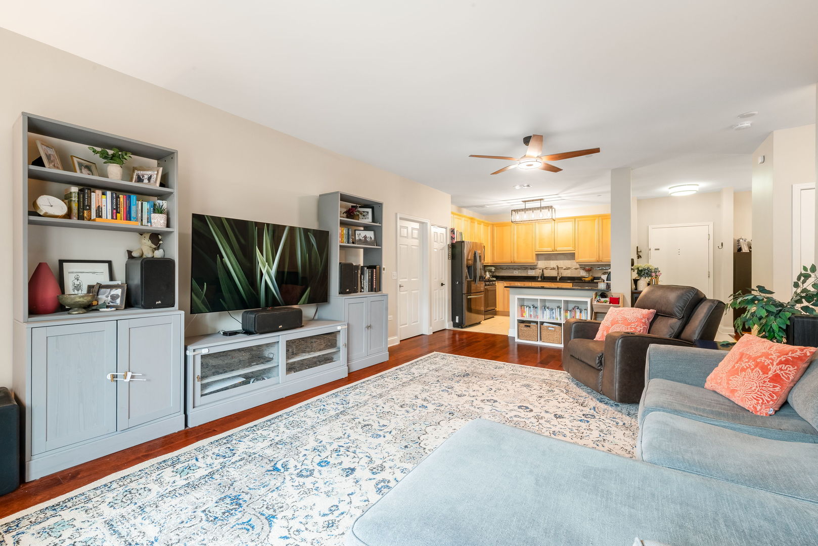 620 McHenry Road, Unit 102 Wheeling, IL 60090 - Photo 6 of 18 a living room with furniture and a flat screen tv