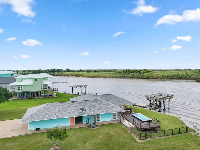 a view of a lake with a house in the background