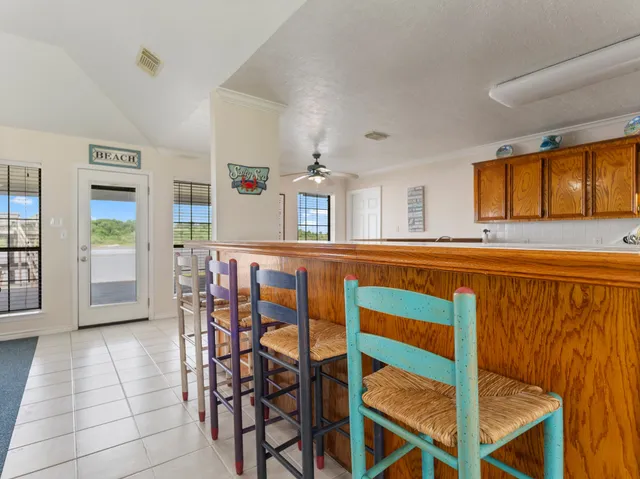a view of a dining room with furniture and window