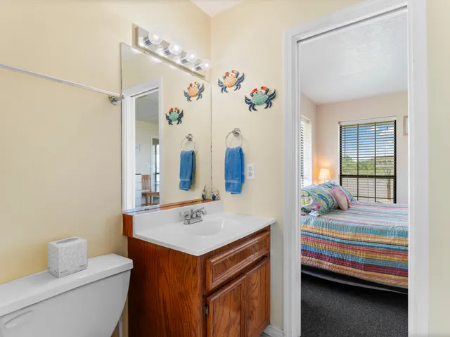 a en suite bathroom with a sink and a mirror