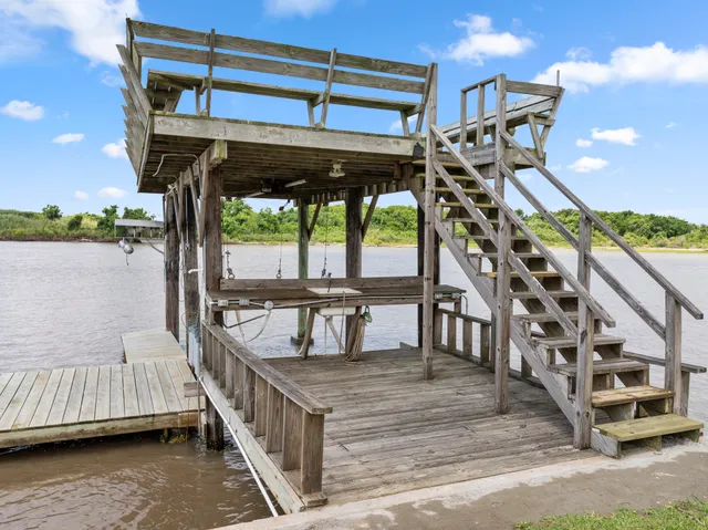 a view of a balcony with furniture and umbrella