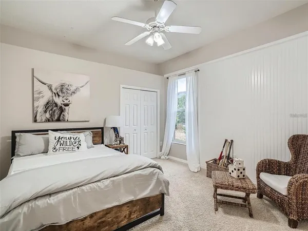 a bedroom with a bed and a couch